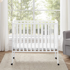 Delta Children Lee Portable Folding Mini Crib with 1.5 - Inch Mattress - Greenguard Gold Certified, Bianca White